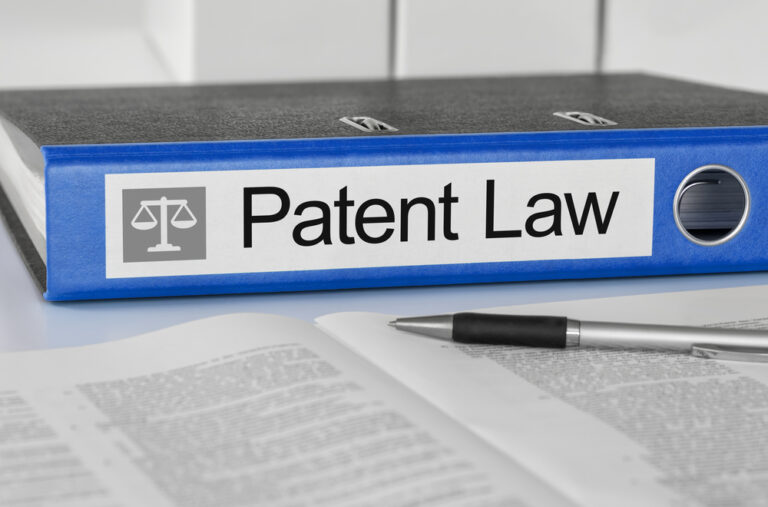 patent law sign on binder for patent protection blog post