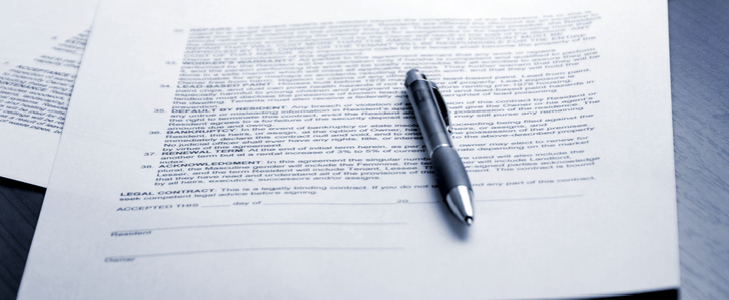 Licensing agreement and a pen on a table