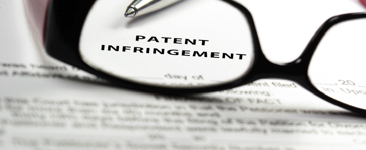 Patent Infringement written on a piece of paper