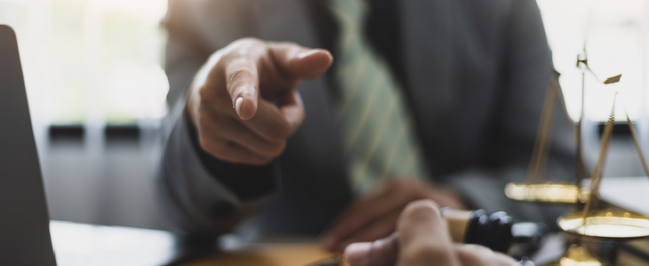 Lawyer pointing to the camera