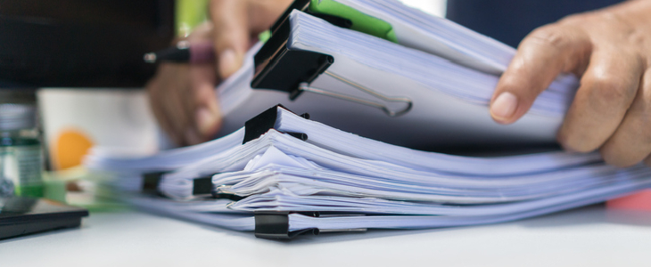 stacks of documents on a table