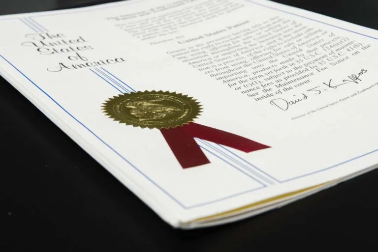 U.S. patent certificate with gold seal and red ribbon