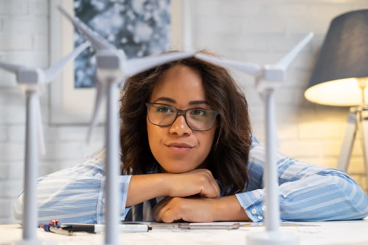 Young inventor starting at her invention