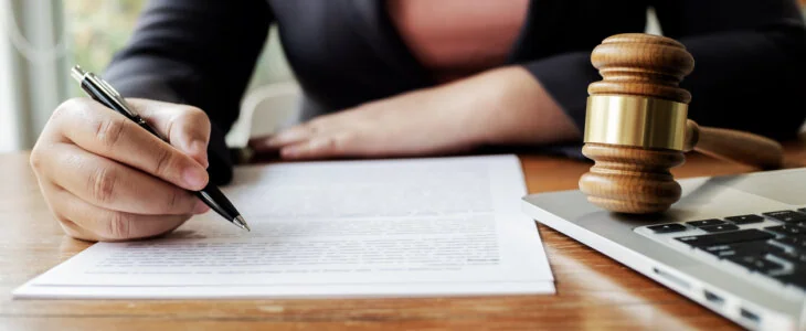 Legal counsel working with lawsuit at courtroom.